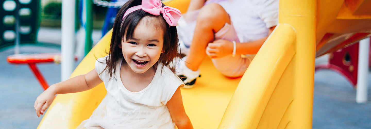 Girl on slide at park