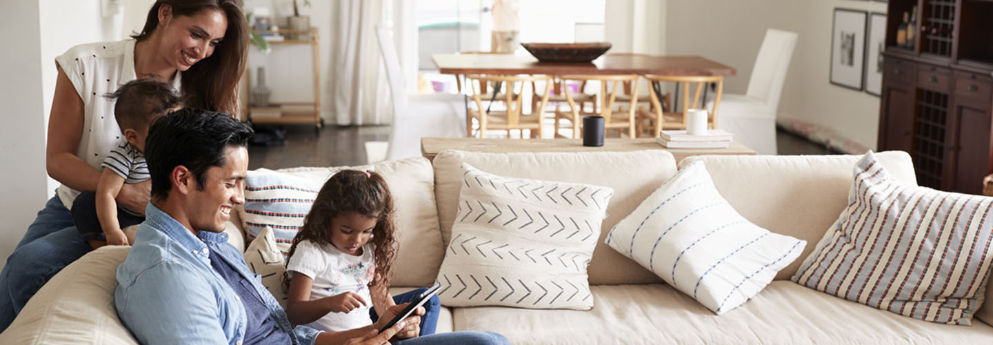 Family on couch in living room